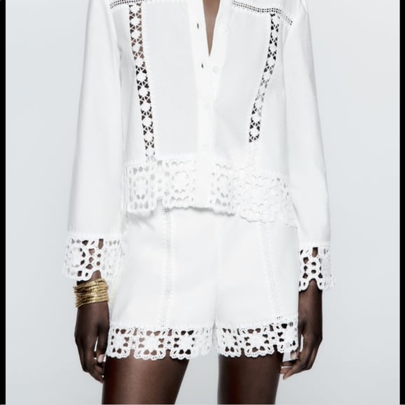 High waisted shorts with tonal crochet appliqué. Side hidden inseam zip closure - Picture 1 of 11